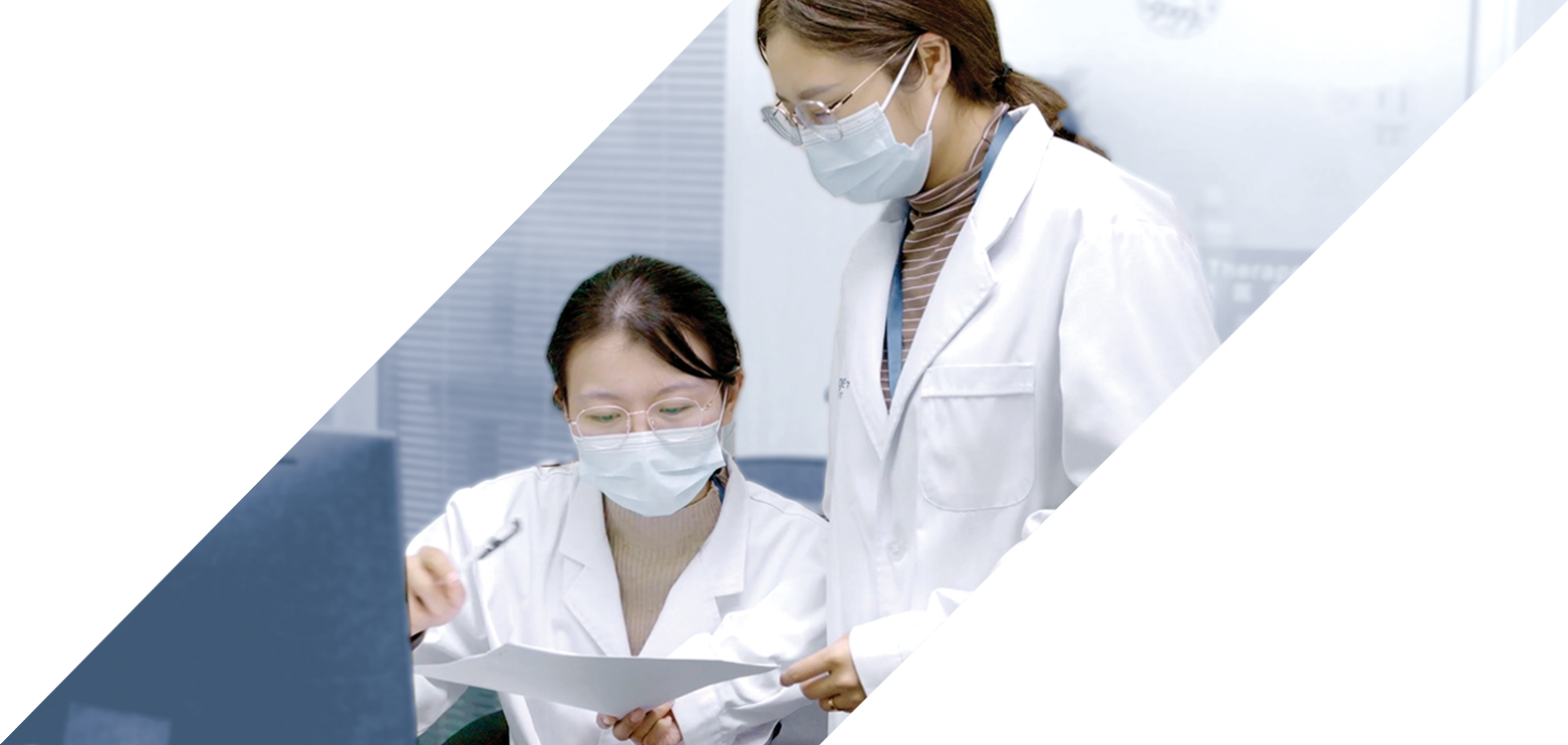 Two female scientists review test results