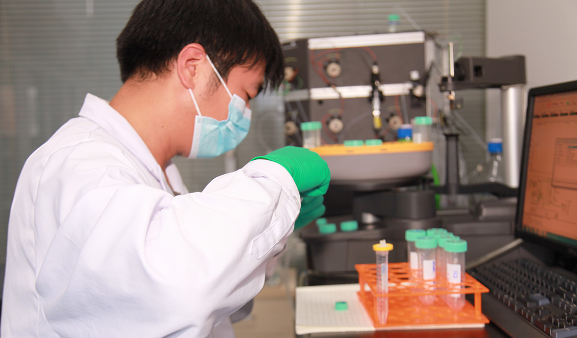 Male scientist working at laboratory bench