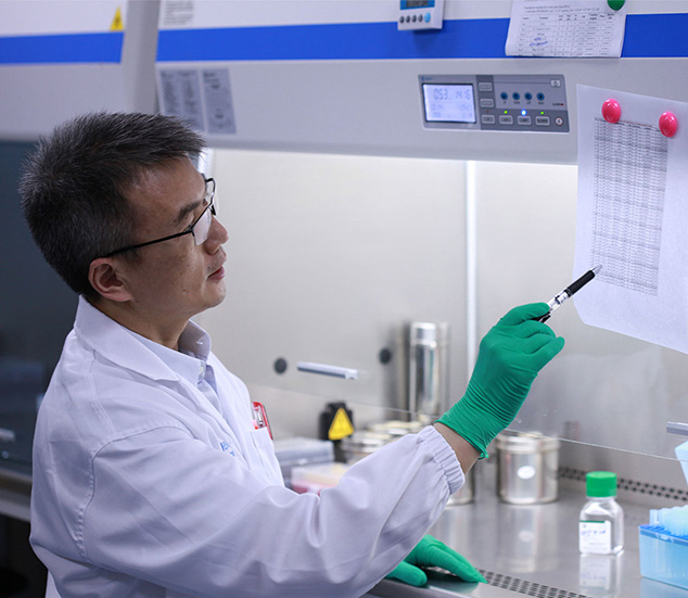 Male scientist reviewing print out